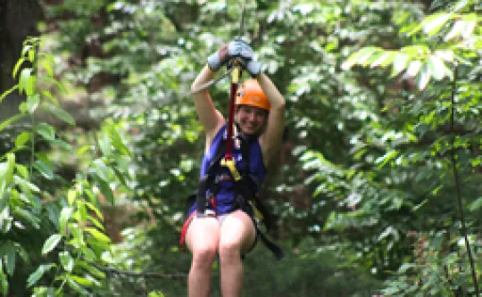 A girl ziplining during a Watia Adventure trip.